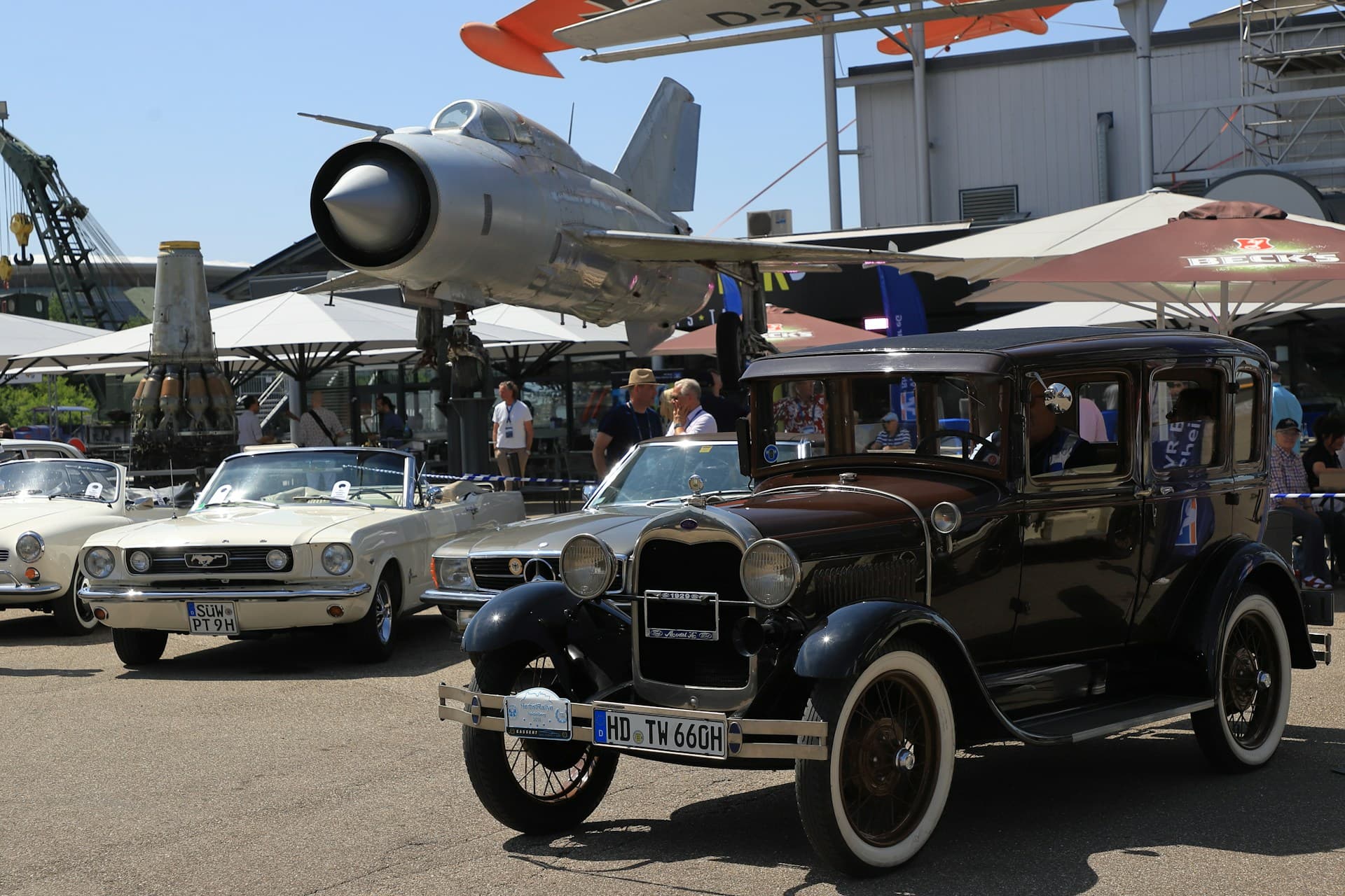 Classic car and aviation event outdoors